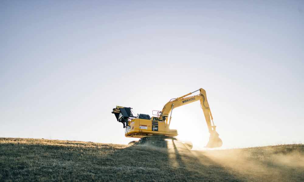 excavator installing a septic system on rural property