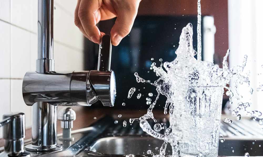 clean treated well water running from a faucet